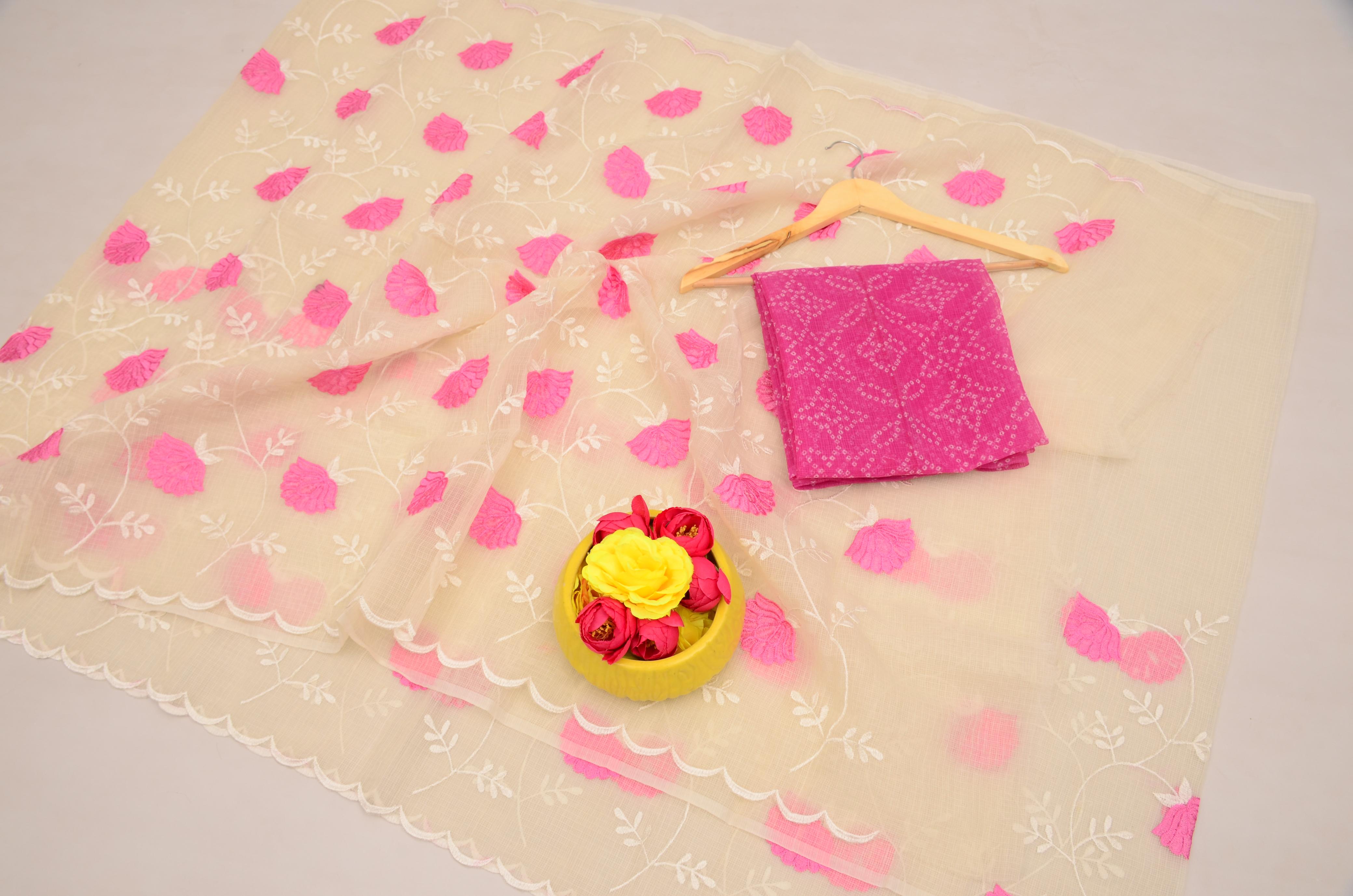 Pink fabric with floral patterns on a light background