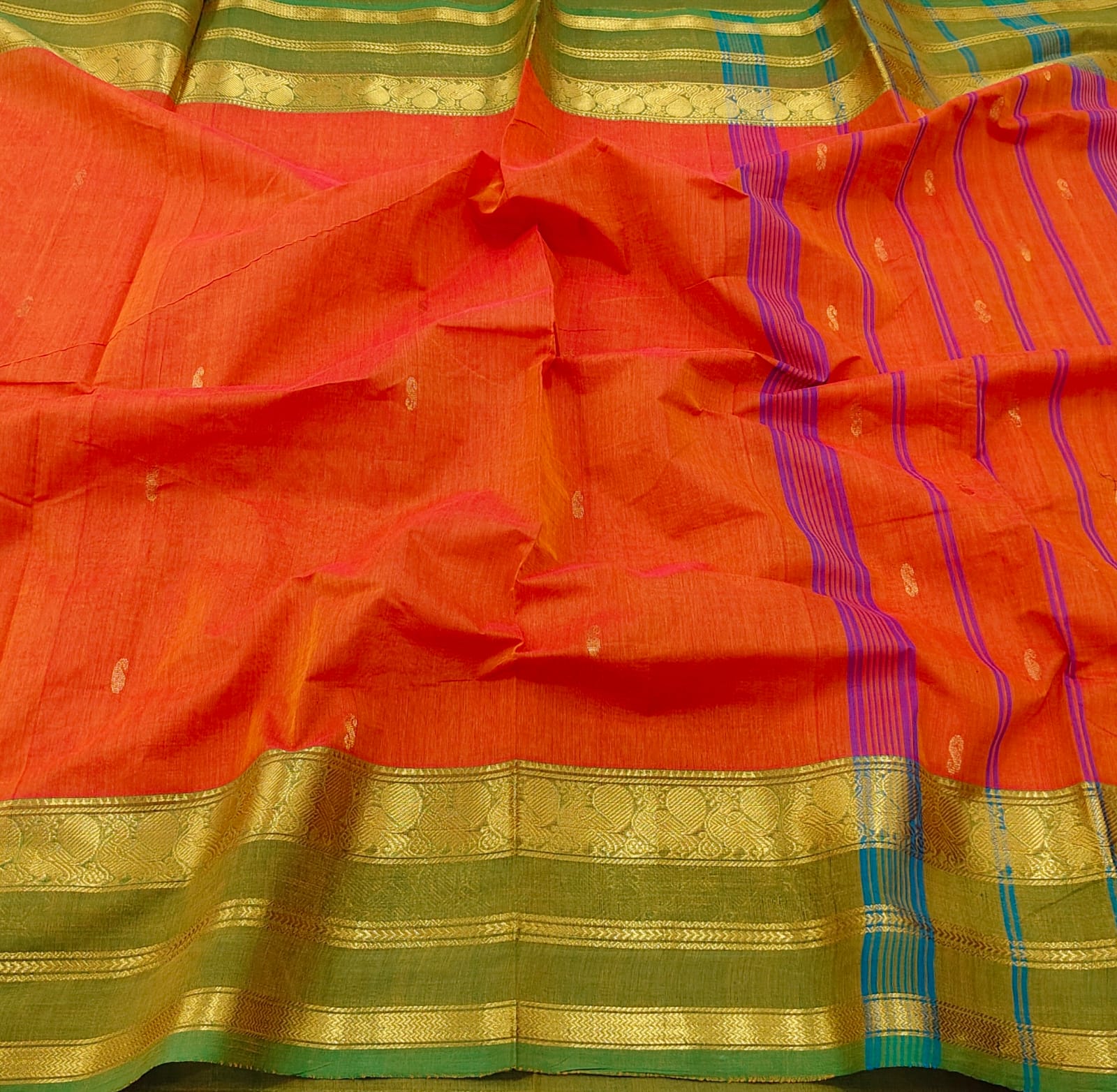 Orange saree with gold and green border