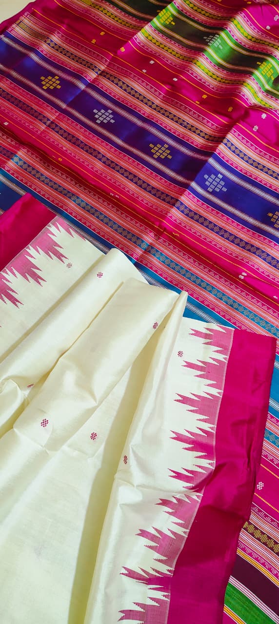Colorful fabric with patterns and a white fabric with pink border