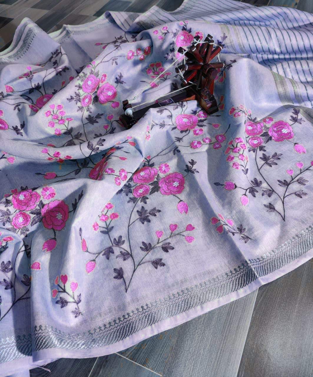 Floral-patterned fabric with pink flowers on a white background