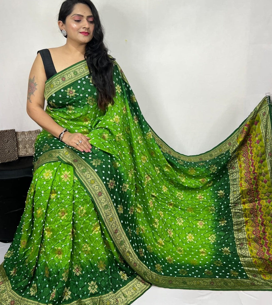Woman wearing a green saree with a white background