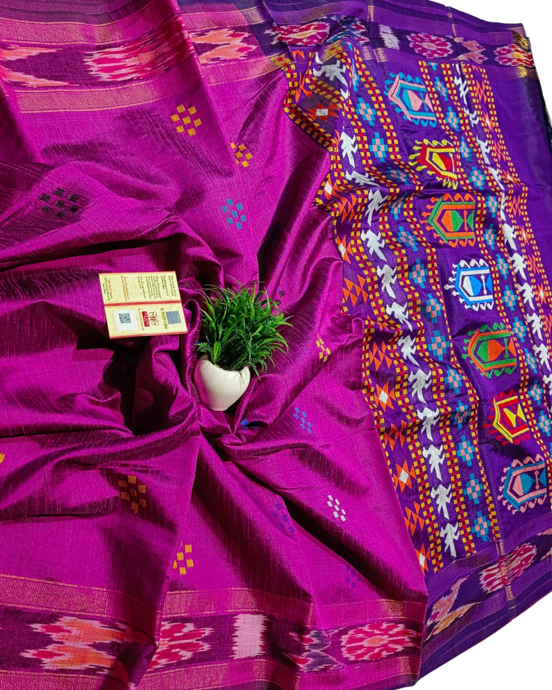 Purple saree with colorful patterns on a white background