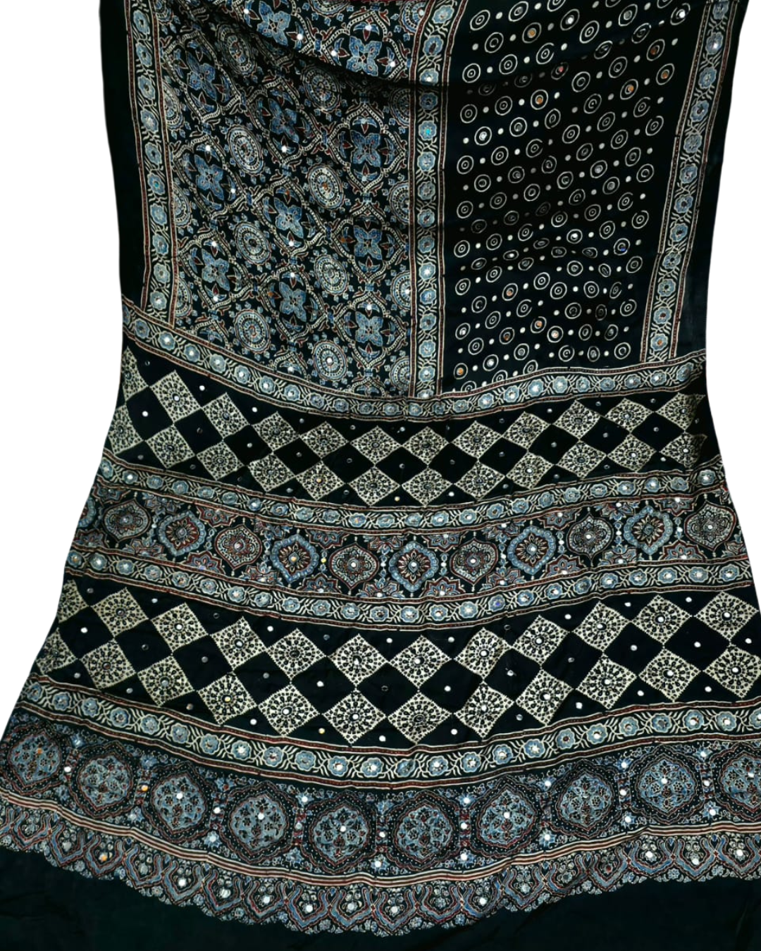 Decorative fabric with intricate patterns and embellishments on a black background