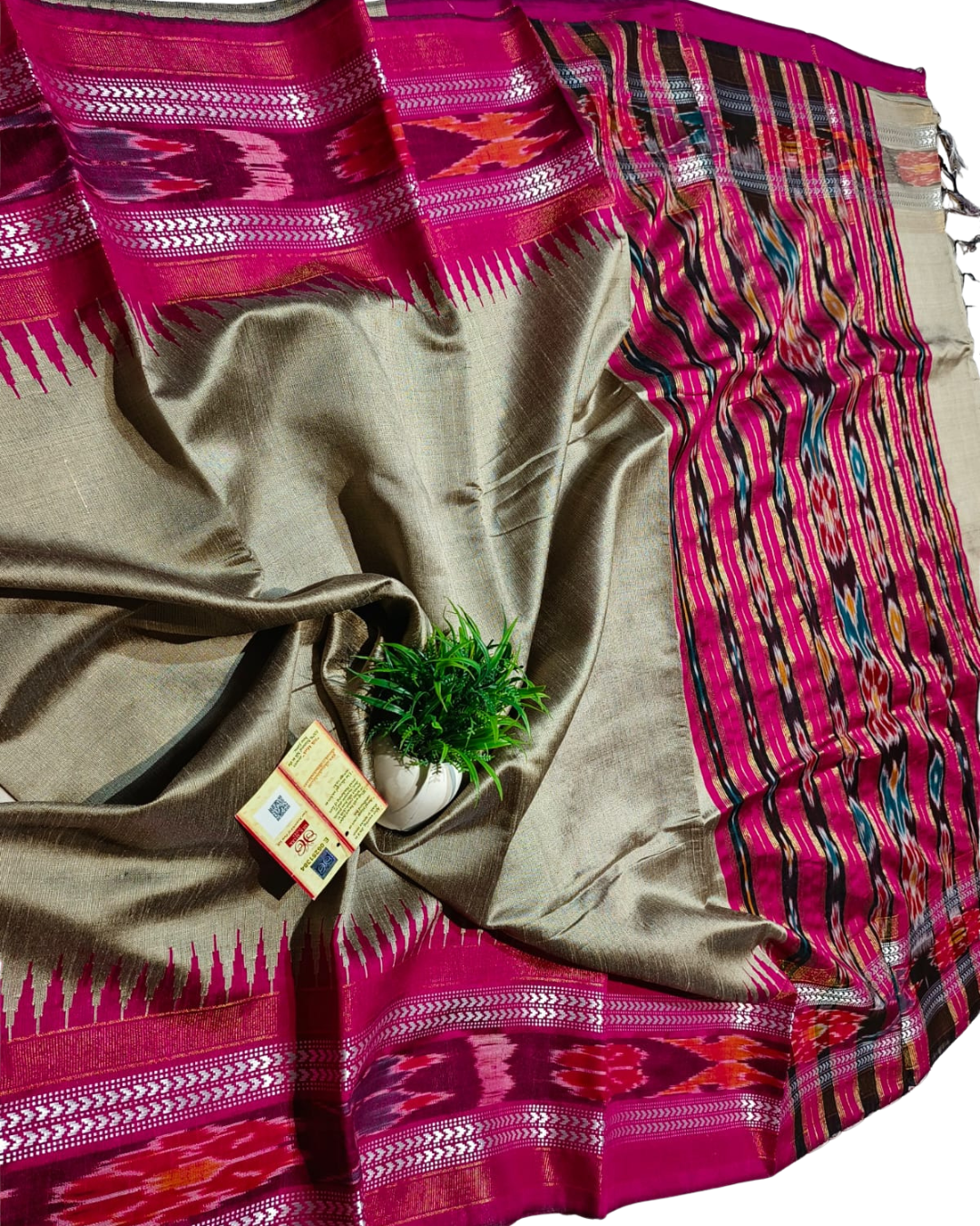 Saree with pink and multicolor patterns on a white background