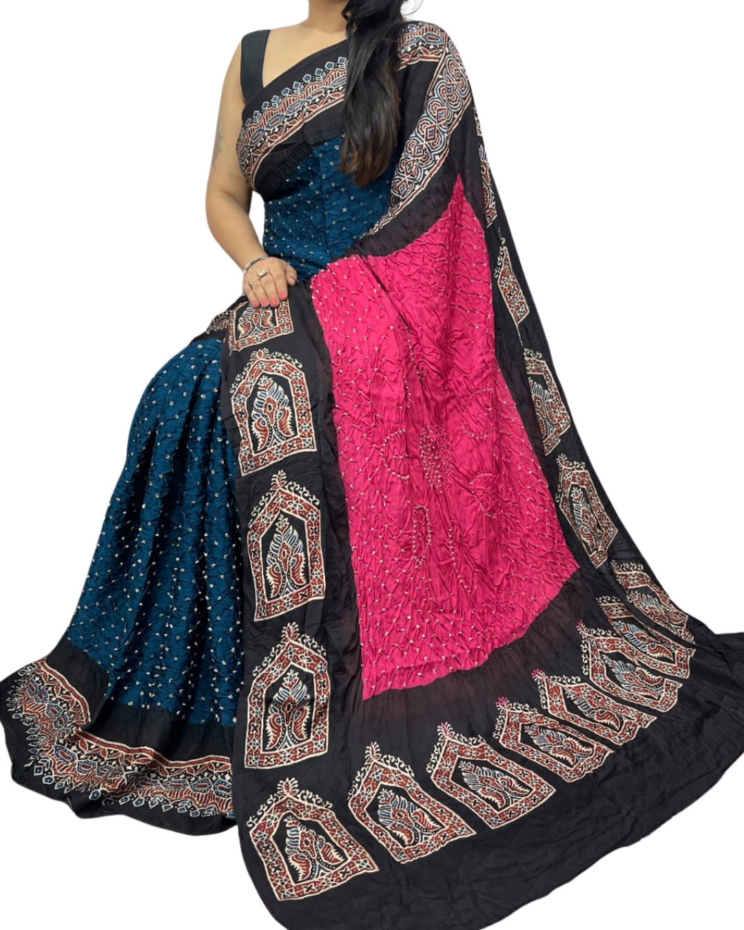 Saree with blue, pink, and black patterns on a white background