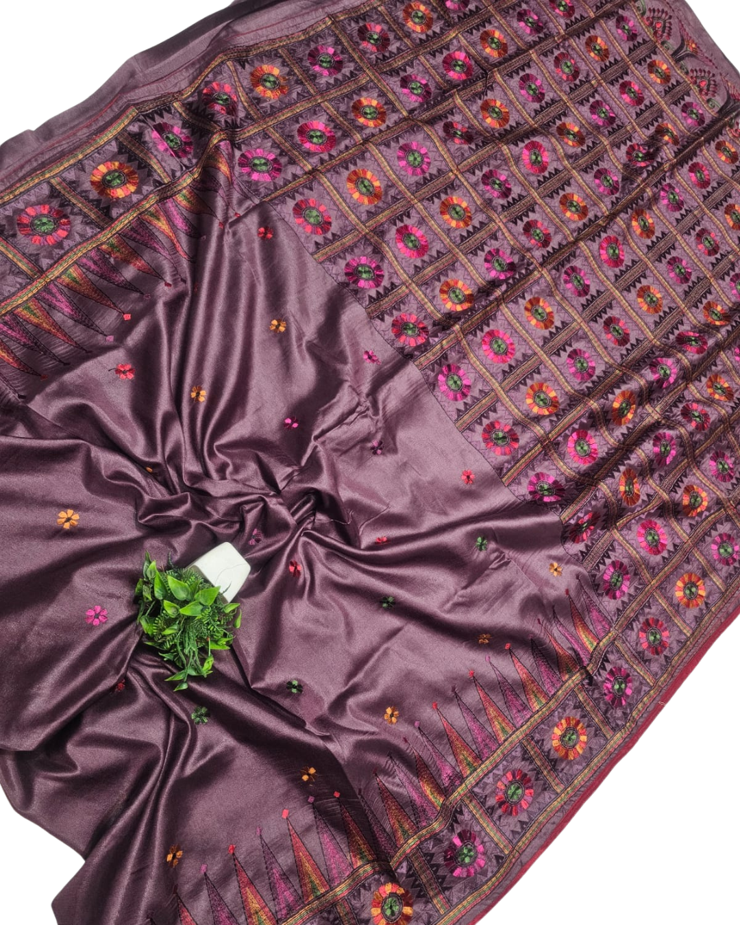 Mauve Purple embroidered fabric with a plant on a white background