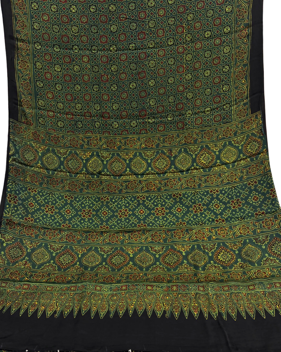 A close-up of a black fabric textile with dense traditional embroidery in green, gold, and red. The fabric features multiple horizontal bands of intricate geometric and floral patterns, finished with a decorative scalloped border at the bottom.