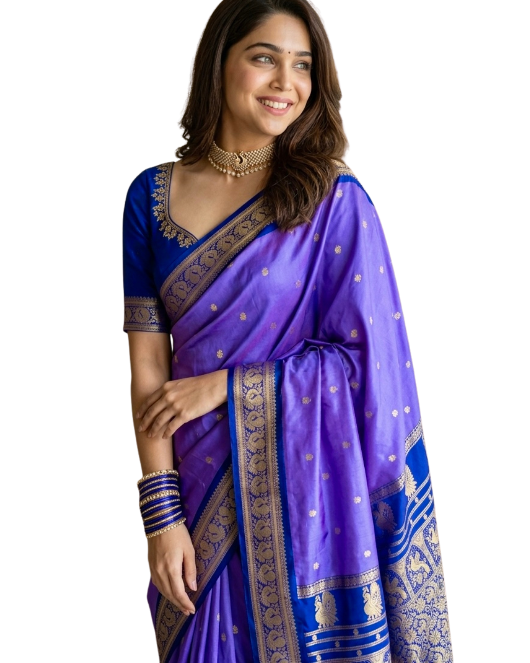 A woman modeling a purple silk saree with gold zari embroidery and a matching purple embroidered blouse against a plain white background.