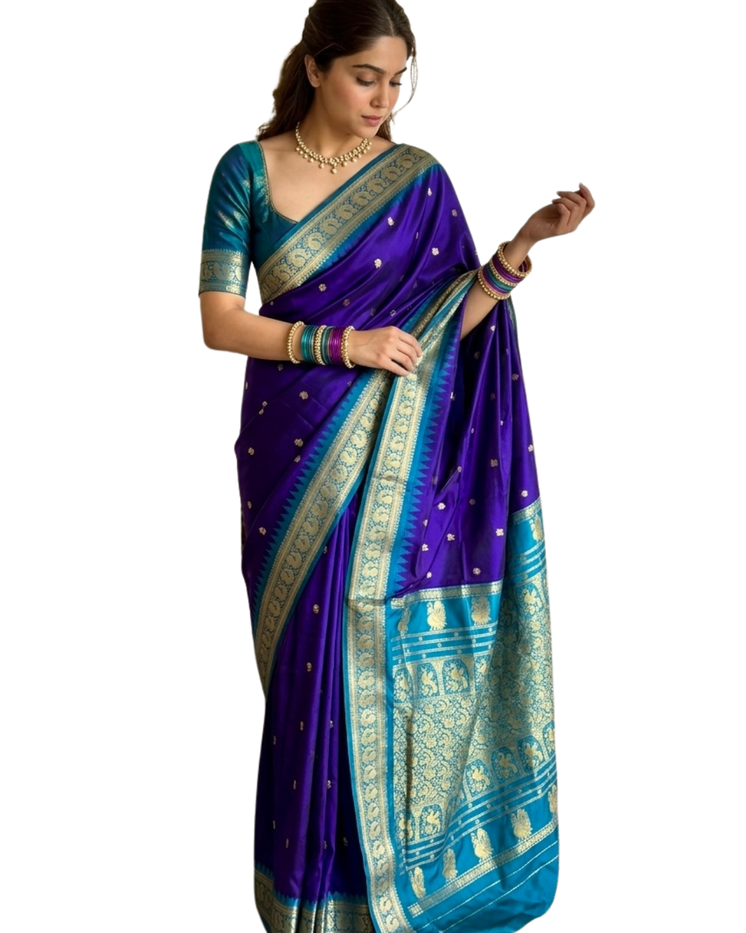 A woman modeling a royal blue and teal silk saree with intricate gold zari patterns and motifs, set against a plain white background.